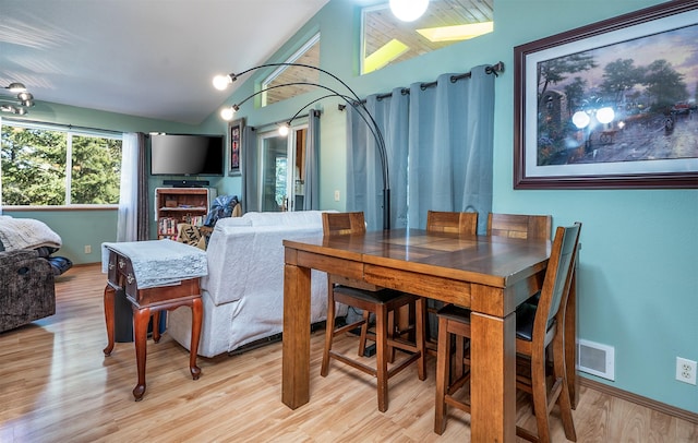 103 Tamarack Woods Dr, Lakeside, MT 59922 - dining space featuring light wood-style floors, lofted ceiling, and visible vents