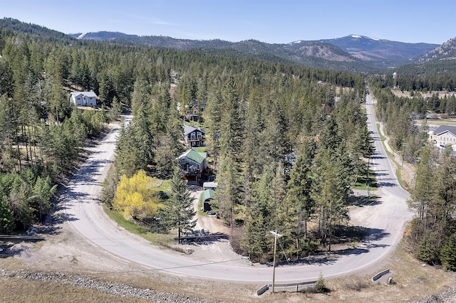 103 Tamarack Woods Dr, Lakeside, MT 59922 - drone / aerial view featuring a wooded view and a mountain view