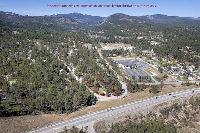 103 Tamarack Woods Dr, Lakeside, MT 59922 - bird's eye view with a mountain view and a wooded view