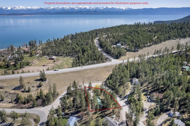103 Tamarack Woods Dr, Lakeside, MT 59922 - aerial view featuring a water and mountain view and a wooded view