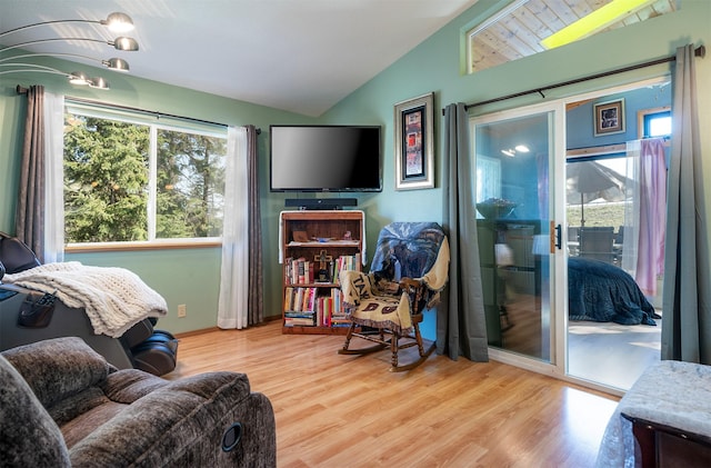 103 Tamarack Woods Dr, Lakeside, MT 59922 - living area with wood finished floors and lofted ceiling