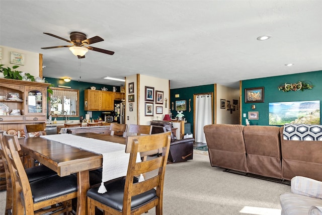 dining space featuring a ceiling fan, recessed lighting, and light colored carpet