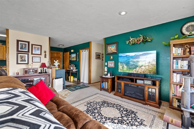 living area featuring baseboards and carpet flooring
