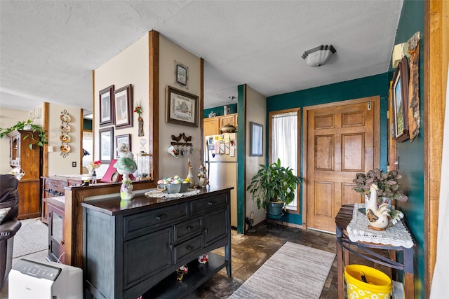entryway featuring a textured ceiling