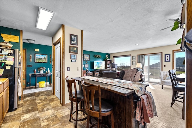 dining room with a textured ceiling