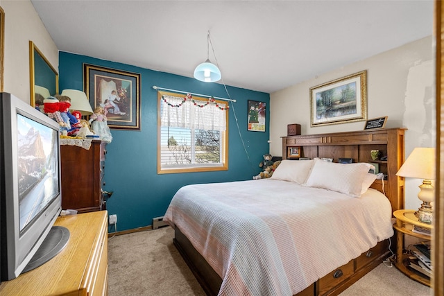 bedroom with baseboards and carpet flooring