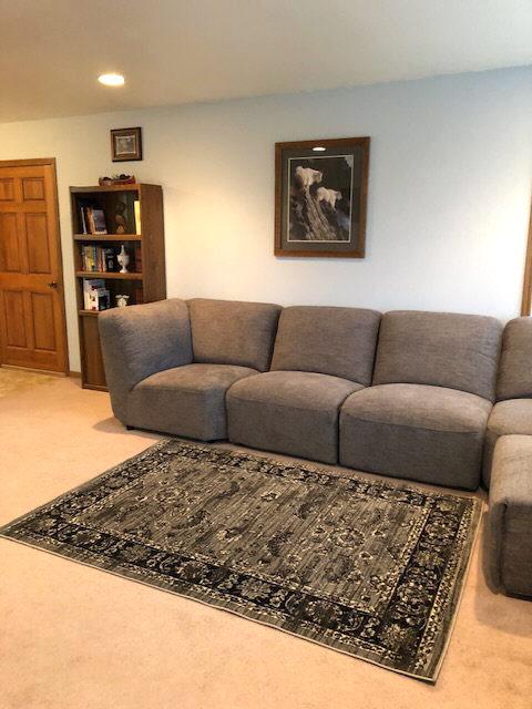 carpeted living room with recessed lighting