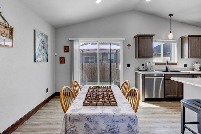 dining area with recessed lighting, baseboards, light wood finished floors, and lofted ceiling