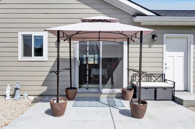 property entrance featuring a patio area