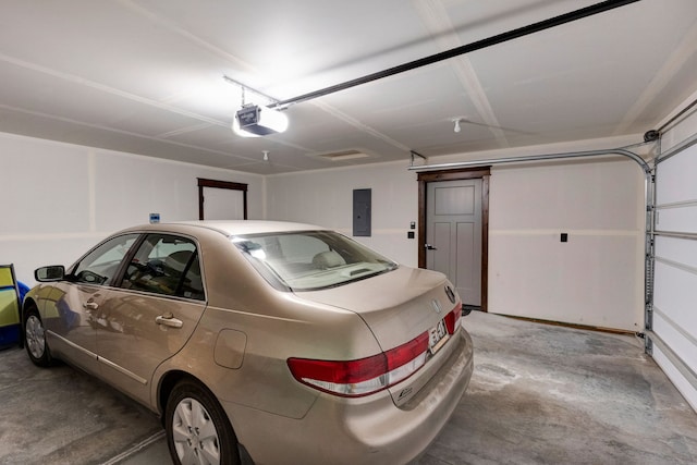 garage featuring a garage door opener and electric panel