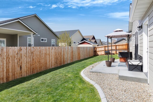 107 One Way Loop, Hamilton, MT 59840 - fenced backyard featuring a gazebo, a patio, and a residential view