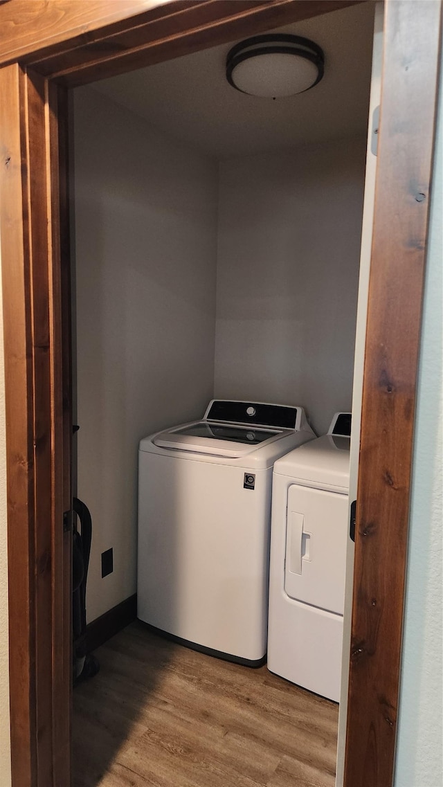 107 One Way Loop, Hamilton, MT 59840 - washroom with washing machine and dryer and wood finished floors