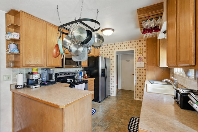kitchen featuring open shelves, decorative backsplash, light countertops, a sink, and stainless steel appliances