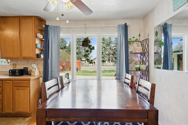 dining area with ceiling fan