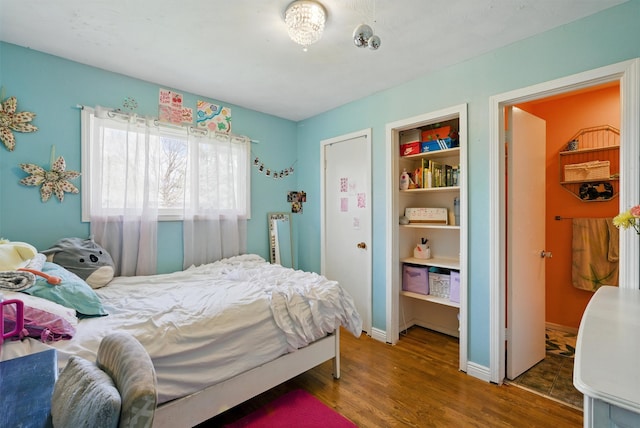 bedroom featuring wood finished floors