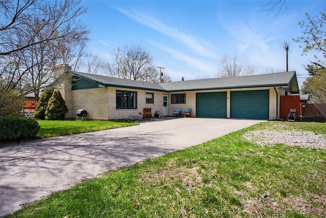 ranch-style home featuring a garage, fence, a chimney, brick siding, and concrete driveway