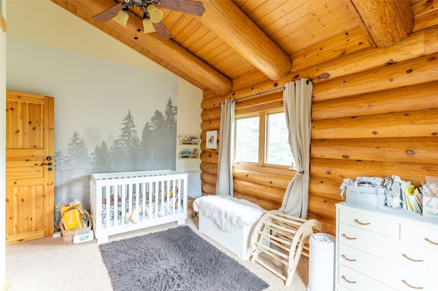 carpeted bedroom with log walls, a nursery area, wood ceiling, and beamed ceiling