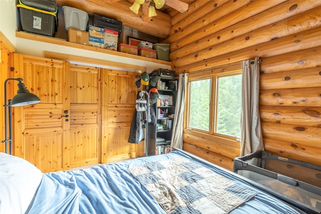 bedroom featuring rustic walls