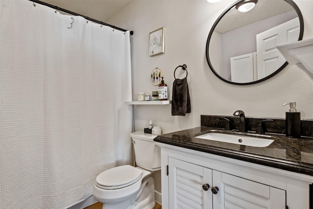 9225 Sharptail Dr, Missoula, MT 59808 - bathroom with vanity, toilet, and a shower with curtain