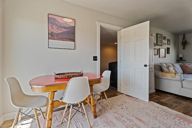 dining room with wood finished floors