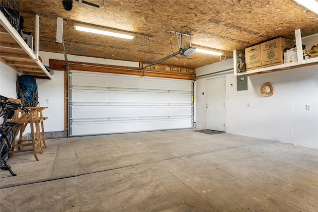 garage featuring a garage door opener and electric panel