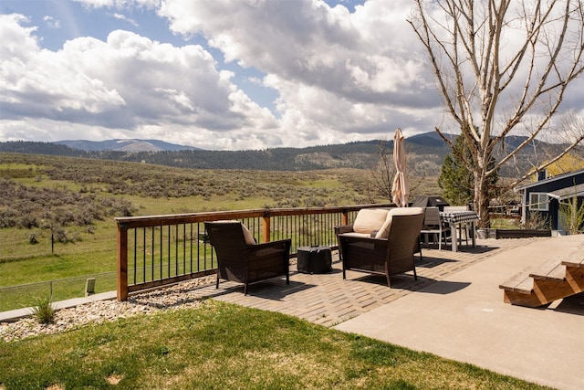exterior space featuring a mountain view and an outdoor living space