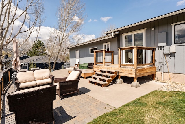view of patio with outdoor lounge area and a wooden deck