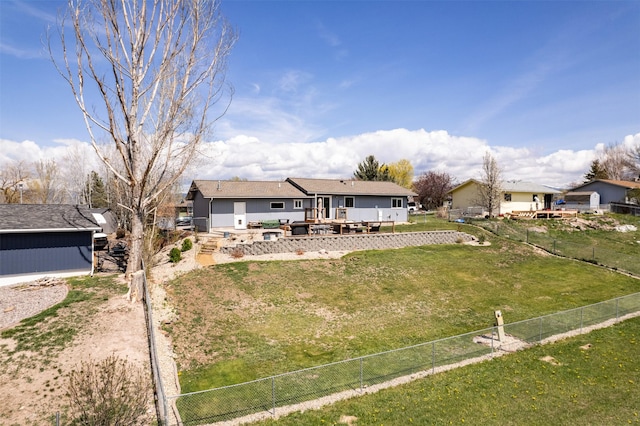ranch-style house with a fenced backyard, a wooden deck, and a front yard