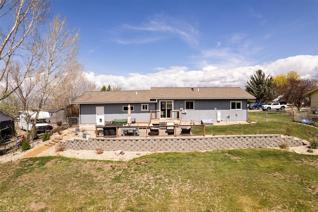 9225 Sharptail Dr, Missoula, MT 59808 - back of property featuring a wooden deck and roof with shingles