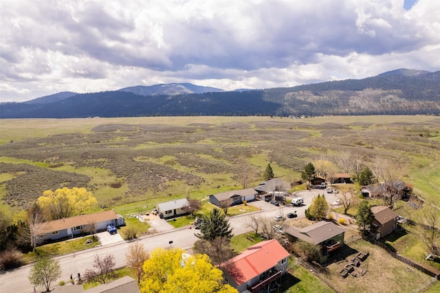 birds eye view of property featuring a mountain view
