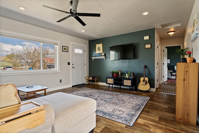 9225 Sharptail Dr, Missoula, MT 59808 - living area with wood finished floors, a ceiling fan, attic access, baseboards, and a textured ceiling