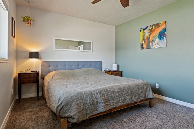 bedroom featuring carpet floors, a textured ceiling, baseboards, and a ceiling fan