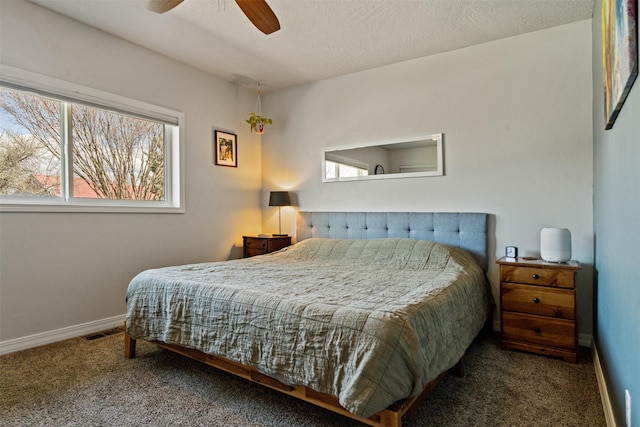 9225 Sharptail Dr, Missoula, MT 59808 - bedroom featuring carpet, multiple windows, baseboards, and ceiling fan