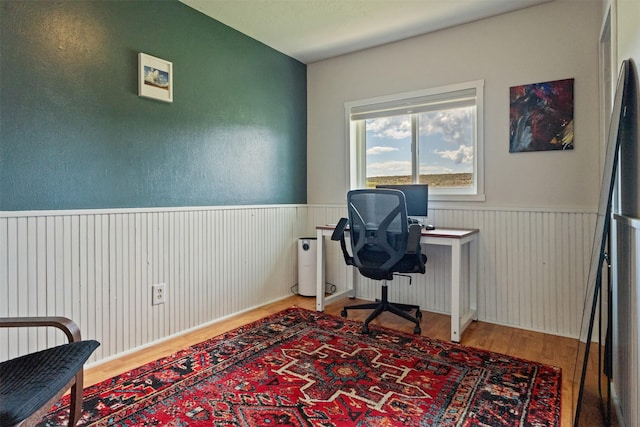 9225 Sharptail Dr, Missoula, MT 59808 - office with wood finished floors and a wainscoted wall