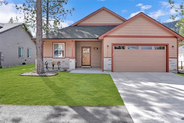 11469 Ninebark Way, Missoula, MT 59802 - view of front of home featuring a garage, concrete driveway, a front lawn, stone siding, and roof with shingles