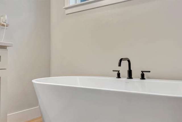 full bath with a freestanding bath