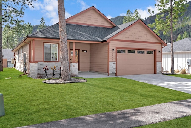 11469 Ninebark Way, Missoula, MT 59802 - view of front of house featuring roof with shingles, a front yard, a garage, and concrete driveway