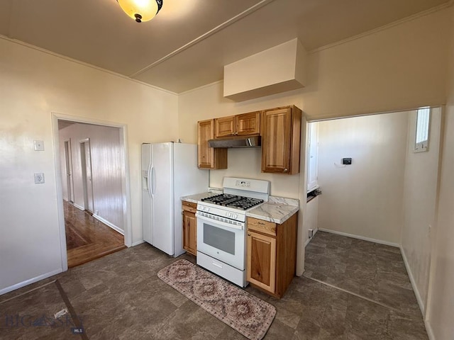 kitchen featuring light countertops, under cabinet range hood, brown cabinets, and white appliances