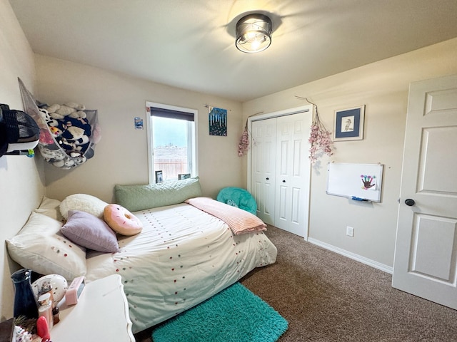 8626 Snapdragon Dr, Missoula, MT 59808 - carpeted bedroom with a closet and baseboards