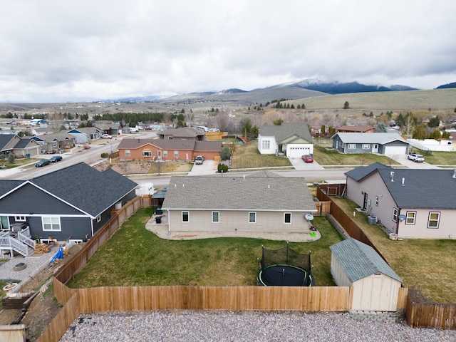 8626 Snapdragon Dr, Missoula, MT 59808 - aerial perspective of suburban area with a mountain backdrop