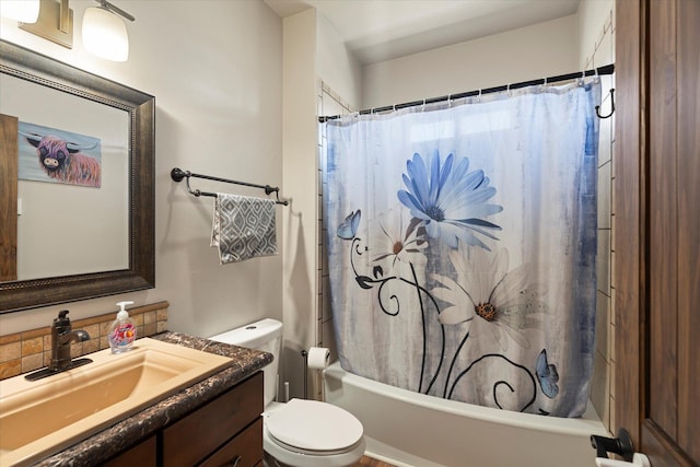 bathroom with toilet, shower / tub combo, and vanity