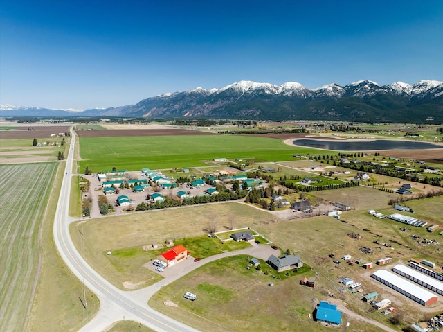 bird's eye view with a rural view and a water and mountain view