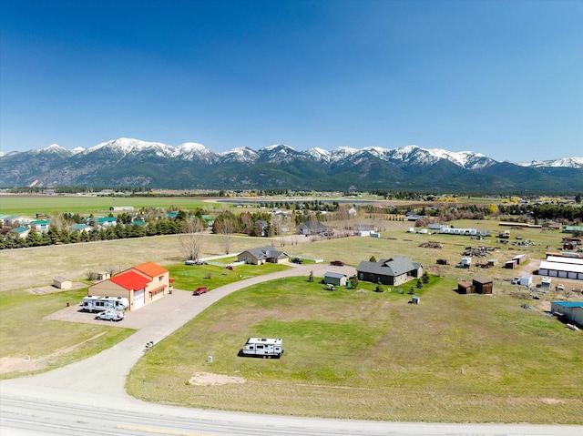 birds eye view of property with a mountain view and a rural view