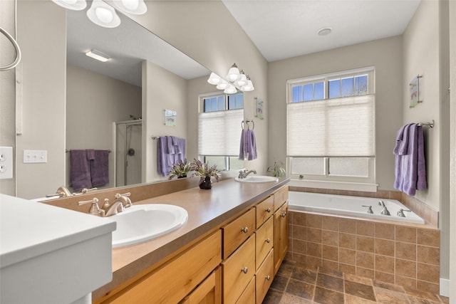 154 Taelor Rd, Kalispell, MT 59901 - full bath featuring a stall shower, double vanity, a garden tub, and stone finish flooring