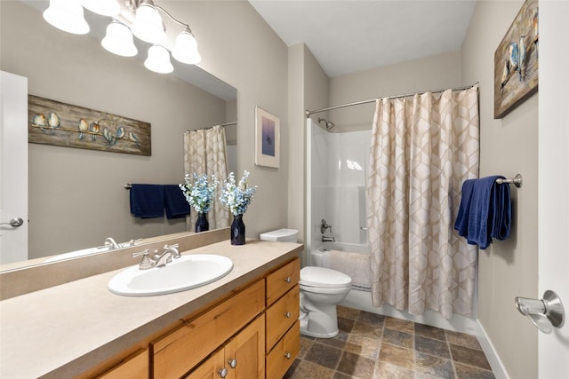 full bath with stone finish flooring, shower / bath combo, vanity, toilet, and a chandelier