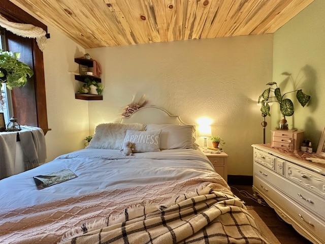 bedroom featuring wooden ceiling and lofted ceiling