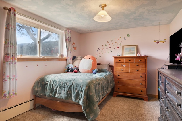 carpeted bedroom with a baseboard radiator