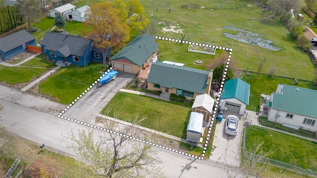 birds eye view of property with a residential view