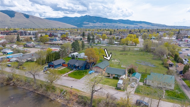 birds eye view of property featuring a mountain view and a residential view