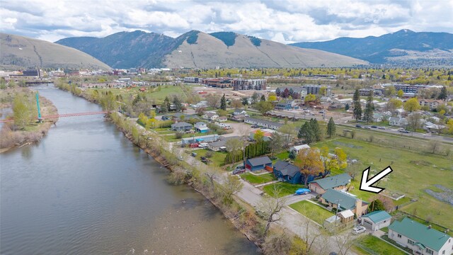 aerial view featuring a water and mountain view